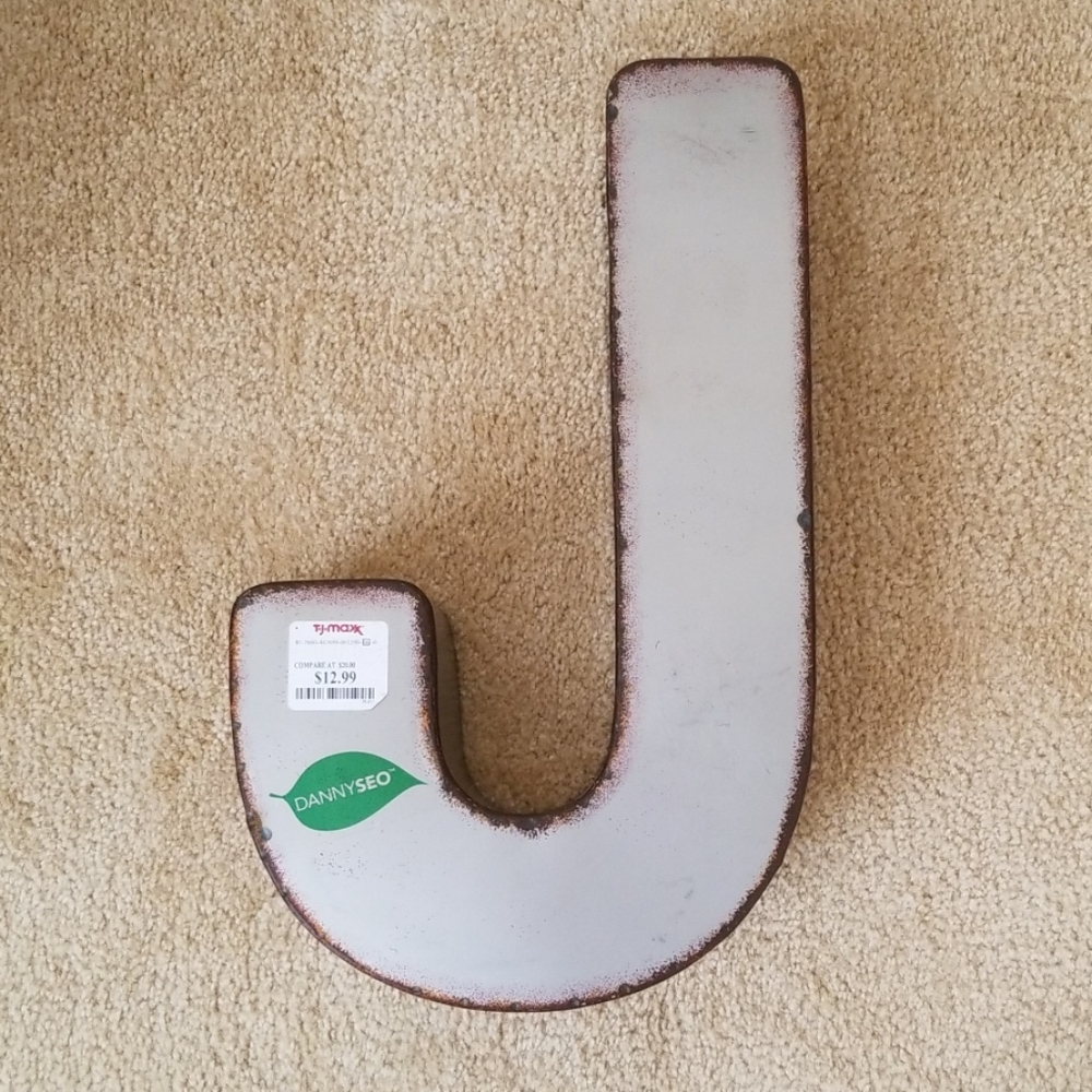 Distressed letter "J"